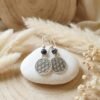 il_fullxfull.7464750574_hq3r Boucles d’Oreilles Pendantes Fleur de Vie Et Hématite Noire – Énergie Et Élégance Fait Main