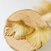 il_fullxfull.6461023933_j5ra Boucles D’Oreilles Feuille De Ginkgo Dorée Chic